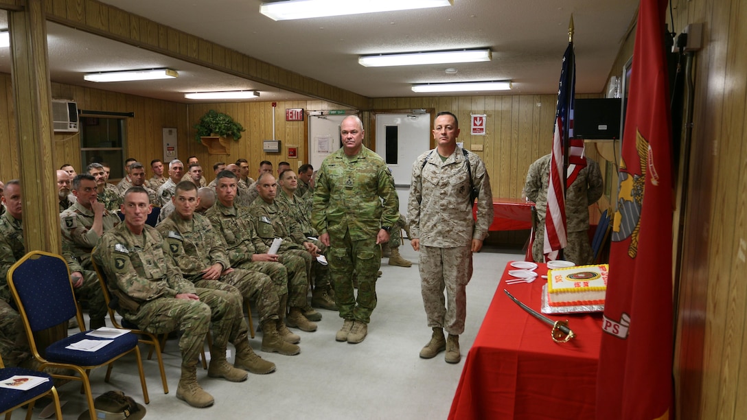 FORWARD OPERATING BASE UNION III, Iraq - Brig. Gen. Rick A. Uribe, Deputy Commanding General-Baghdad of Combined Joint Forces Land Component Command – Operation INHERENT RESOLVE, right, and Australian BRIG Roger Noble, the Guest of Honor, left, participate in a cake cutting ceremony for the Marine Corps’ 241st birthday at Forward Operating Base Union III, Baghdad, Iraq, November 10, 2016.