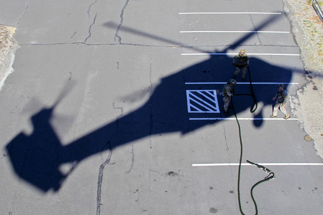 Airmen prepare a rope extraction system during a joint training exercise with the New Jersey State Police at Island Beach State Park, N.J., Nov. 18, 2016. Air National Guard photo by Tech. Sgt. Matt Hecht