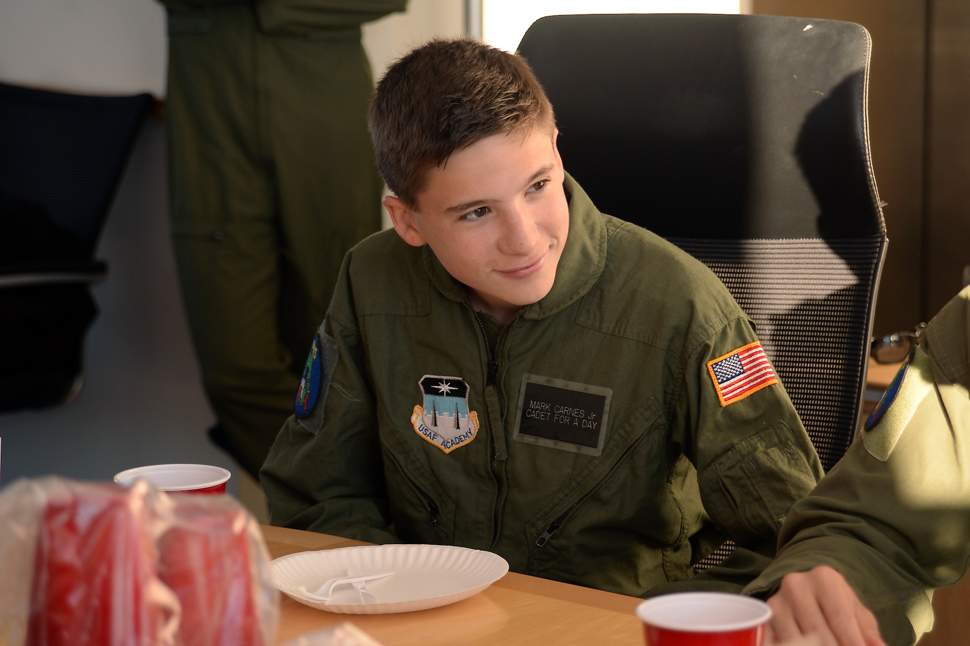 Mark Carnes, 15, eats breakfast with cadets and staff at the U.S. Air Force Academy, Nov. 10, 2016. Carnes became an Academy cadet for a day through the Cadet for a Day program run by the Academy and the Make a Wish Foundation since 2000. The program allows children with severe medical conditions to achieve their dreams of becoming an Academy cadet. (U.S. Air Force photo/Darcie Ibidapo) 