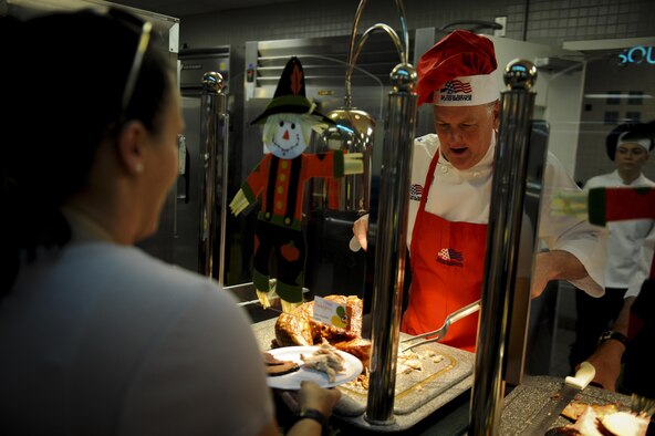 Lt. Gen. Brad Webb, the commander of Air Force Special Operations Command, talks to an Air Commando while serving Thanksgiving lunch at the Reef Dining Facility on Hurlburt Field, Fla., Nov. 24, 2016. Webb and other base leadership dined with Hurlburt personnel to celebrate Thanksgiving. (U.S. Air Force photo by Airman Dennis Spain)