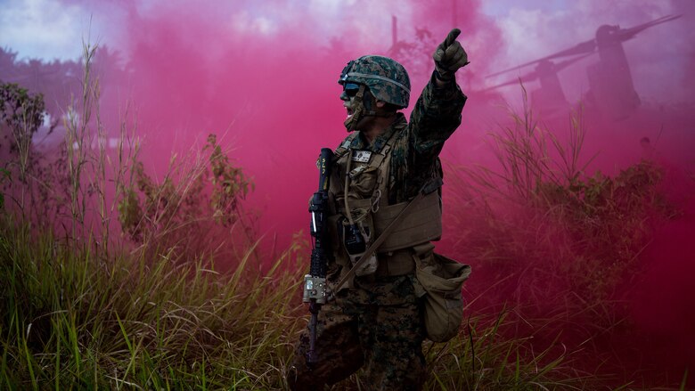 A Marine with Battalion Landing Team 1st Bn., 4th Marines, 11th Marine Expeditionary Unit, gives orders to his team during the final exercise of Exercise Tiger Strike 2016, in Sabah Province, Malaysia, Nov. 13, 2016. The final exercise served as a demonstration of U.S. and Malaysian bilateral capabilities to plan, communicate and execute amphibious operations.