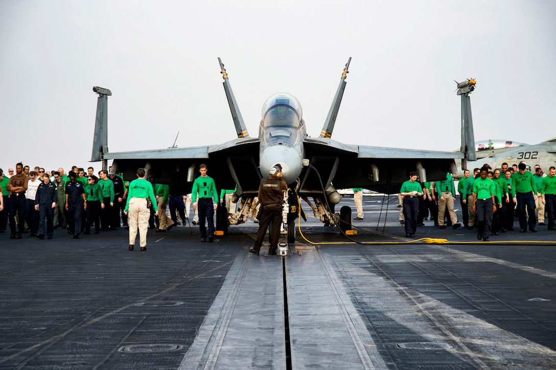 Sailors conduct a foreign object walk down on the flight deck of the aircraft carrier USS Dwight D. Eisenhower in the Persian Gulf, Nov. 23, 2016. The Eisenhower and its Carrier Strike Group are deployed in support of Operation Inherent Resolve, maritime security operations and theater security cooperation efforts in the U.S. 5th Fleet area of operations. Navy photo by Petty Officer 3rd Class Nathan T. Beard