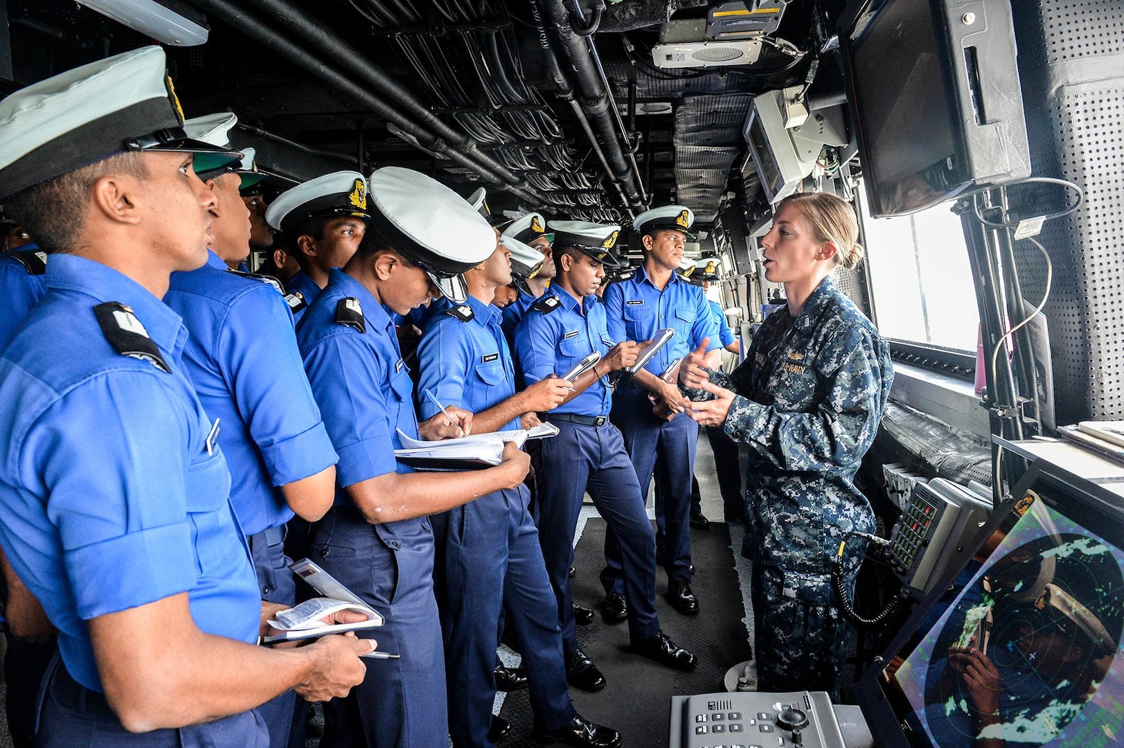 Lt. j.g. Jill Carnahan conducts a ship tour with Sri Lanka Navy sea cadets aboard the amphibious transport dock ship USS Somerset (LPD 25) during a theater security cooperation exchange with the Sri Lankan military, Nov. 24, 2016. Somerset and embarked 11th Marine Expeditionary Unit are conducting the exchange with Sri Lankan forces in order to enhance tactical skill sets and disaster relief capabilities while strengthening the overall relationship between the two forces 