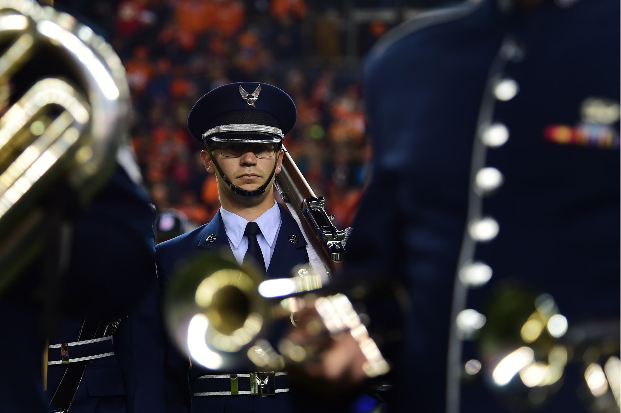 Airman 1st Class Paul Lombardi, 566th Intelligence Squadron signals intelligence analyst, participates in a Denver Broncos Salute to Service pregame ceremony Nov. 27, 2016, at Sports Authority Field at Mile High in Denver. Service members took part in both the pregame and halftime ceremonies as part of the Salute to Service program that aims to recognize their dedication. (U.S. Air Force photo by Airman 1st Class Gabrielle Spradling/Released)