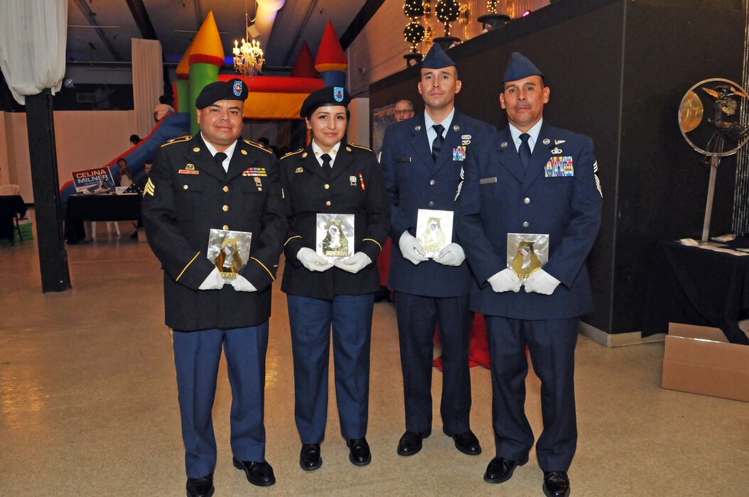 From Left: Army Sgt. Sam Owen, Army Spc. Monica Montoya, Air Force Tech. Sgt. Geiber Rea, and Air Force Chief Master Sgt. John Salazar were presented with awards in recognition of their military service on Oct. 25, 2016 at the League of United Latin American Citizens Utah's Viva America! event in Salt Lake City. (U.S. Air National Guard photo by Staff Sgt. Annie Edwards)