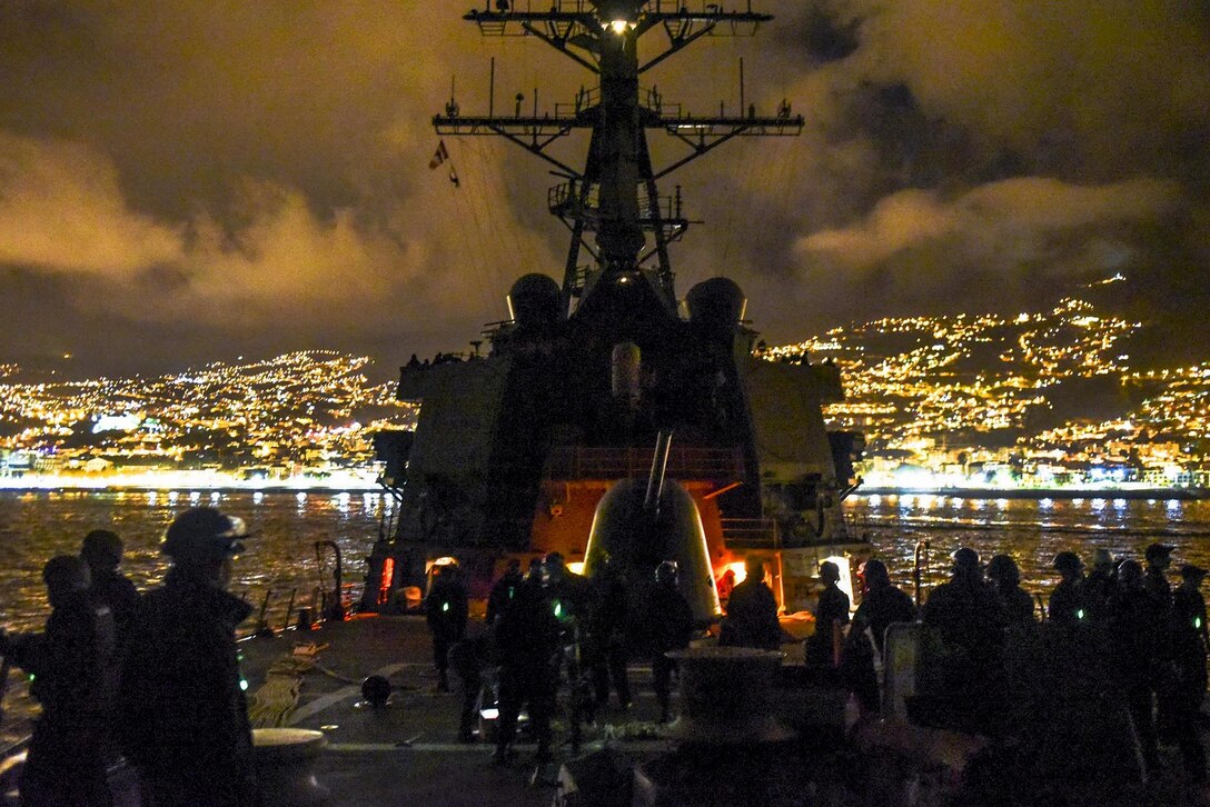 Sailors stand watch aboard the USS Mahan as they depart Funchal, Portugal, Nov. 27, 2016, after a brief stop for fuel. The Mahan is in the U.S. 6th fleet area of operations supporting U.S. national security interests in Europe. Navy photo by Petty Officer 1st Class Timothy Comerford