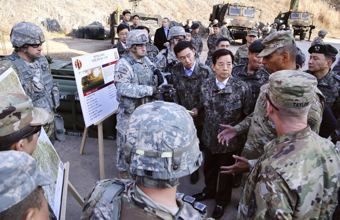 Republic of Korea (ROK) Minister of National Defense Han Min-koo, center, Gen. Vincent K. Brooks, Combined Forces Command commander, and Gen. Leem, Ho-young, Combined Forces Command deputy commander, observe the 2d Infantry Division, ROK/US Combined Division, counter-fire task force, which is postured to attack and destroy artillery and mortar sites in North Korea, Nov. 29, 2016. ”It is always great to have the Minister of Defense visit our troops and see the ironclad ROK-U.S. Alliance in its human form. We appreciate his support and courageous leadership," said Gen. Brooks. (U.S. Army photo by Sgt. 1st Class Sean K. Harp)