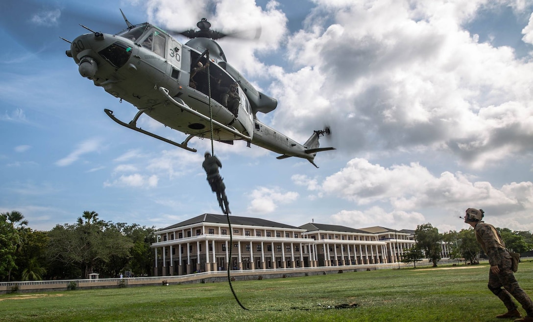 Sri Lankan Navy Special Boat Squadron Sailors fast rope out of a UH-1Y Huey helicopter during a Theater Security Cooperation training exercise at Sri Lanka Naval Base, Trincomalee, Nov. 23, 2016. The SBS Sailors executed multiple fast rope repetitions during the training exercise. The 11th Marine Expeditionary Unit, part of the Makin Island Amphibious Ready Group, is operating in the U.S. 7th Fleet’s area of responsibility in support of security and stability in the Indo-Asia-Pacific region. 