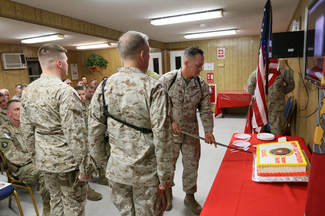 Brigadier General Rick A. Uribe, Deputy Commanding General-Baghdad of Combined Joint Forces Land Component Command – Operation INHERENT RESOLVE, cuts the cake in a cake cutting ceremony for the Marine Corps’ 241st birthday at FOB Union III, Baghdad, Iraq, November 10, 2016. Traditionally, a piece of cake will be presented to the Guest of Honor, the oldest Marine present, and the youngest Marine present.  