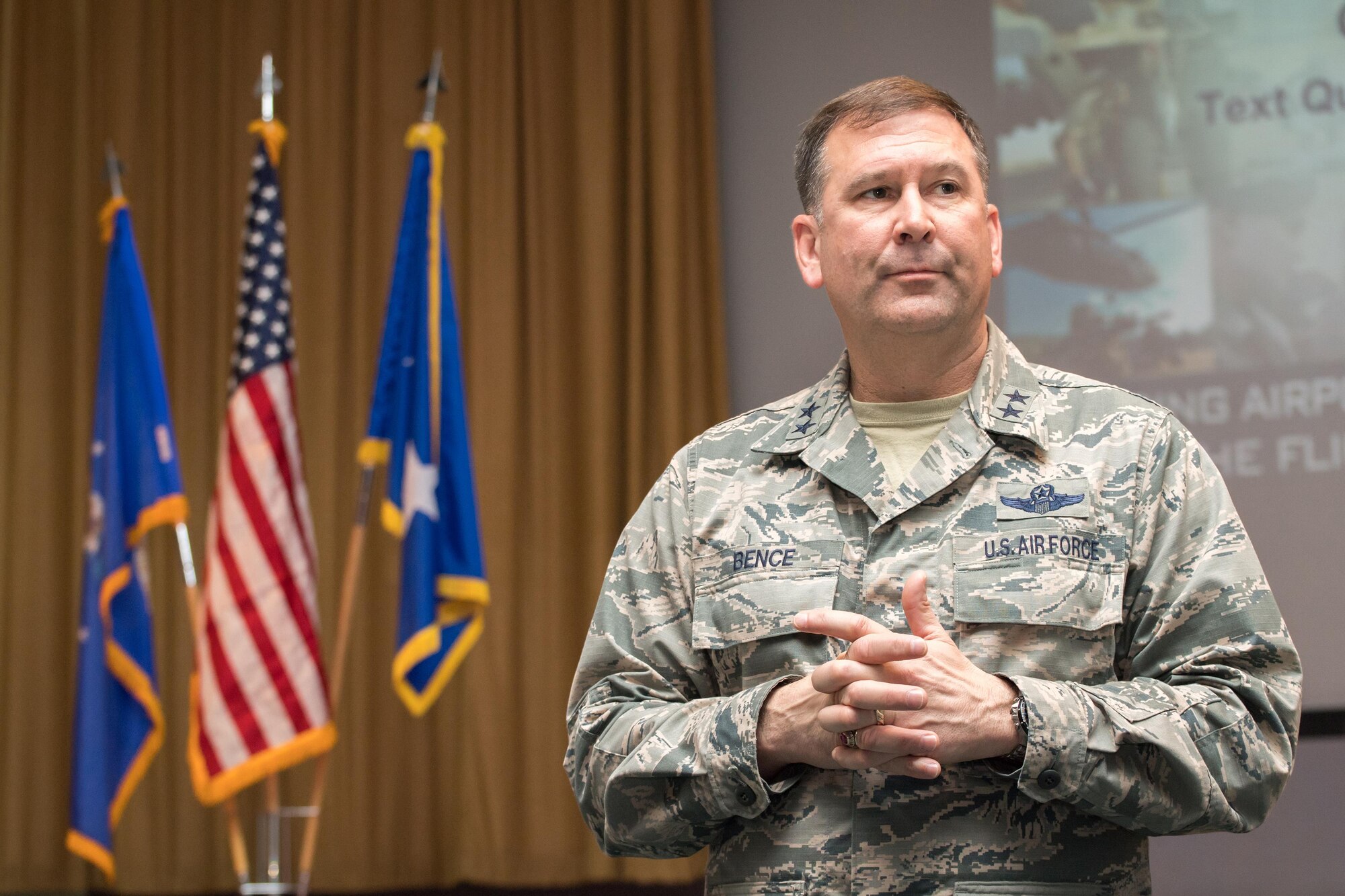 Maj. Gen. Christopher Bence, U.S. Air Force Expeditionary Center commander, listens as an Airman poses a question during the 43d Air Mobility Operations Group All Call held here Nov. 15. Bence toured Air Force units at Pope Field along with Chief Master Sgt. Larry Williams, AFEC command chief, Nov. 15-17. The general took command of the AFEC at Joint Base McGuire-Dix-Lakehurst, New Jersey, in August this year. Both leaders, accompanied by their spouses, met and talked with 43d AMOG Airmen, and also participated in the Air Mobility Command civic leader tour during their visit to Fort Bragg. (Air Force photo/Marc Barnes)