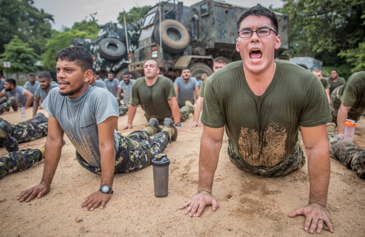 U.S. and Sri Lankan marines stretch after conducting physical training during a theater security cooperation engagement exercise in Trincomalee, Sri Lanka, Nov. 24, 2016. The exercise was the first engagement the 4-month-old Sri Lankan marine corps conducted with another marine corps organization. Marine Corps photo by Lance Cpl. Zachery Laning