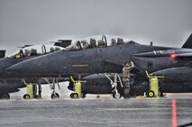 An Airman assigned to Air Combat Command marshals an F-15 Strike Eagle aircraft during a Coronet mission at Morón Air Base, Spain, Nov. 10, 2016. This mission will last almost 60 days and is a major Air Expeditionary Force fighter aircraft swap-out between the U.S. and the Middle East. (U.S. Air Force photo by Capt. Jose A. Quintanilla)