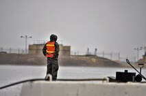 An Airman assigned to the Air Mobility Command stands ready to marshal a KC-135 Stratotanker aircraft prior to its departure at Morón Air Base, Spain, Nov. 10, 2016. This mission will last almost 60 days and is a major Air Expeditionary Force fighter aircraft swap-out between the U.S. and the Middle East. (U.S. Air Force photo by Capt. Jose A. Quintanilla)
