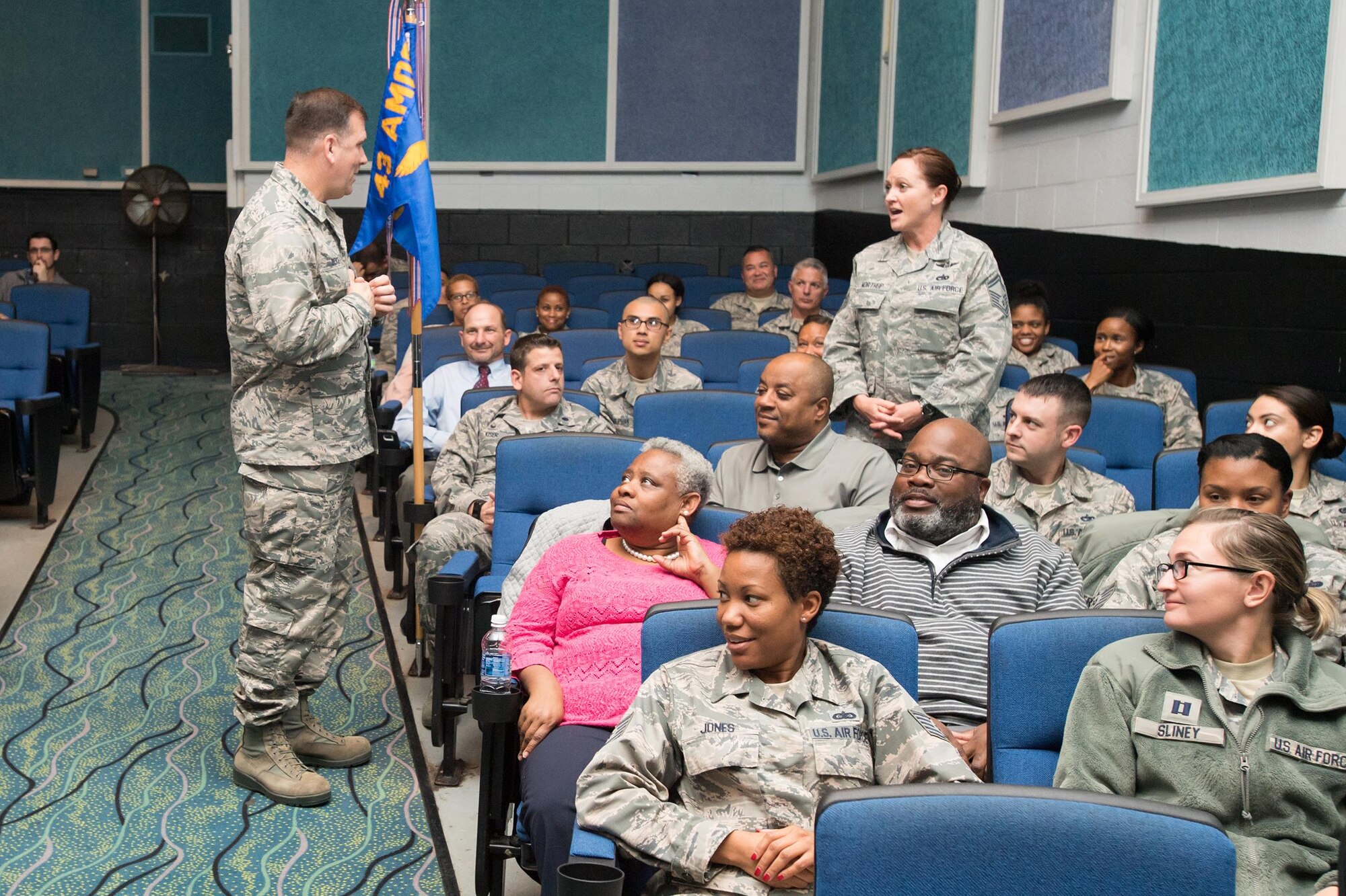 Maj. Gen. Christopher Bence, U.S. Air Force Expeditionary Center commander, listens as Senior Master Sgt. Stephanie Northup, 43d Operations Support Squadron superintendent, poses a question during the 43d Air Mobility Operations Group All Call held here Nov. 15. Bence toured Air Force units at Pope Field along with Chief Master Sgt. Larry Williams, AFEC command chief, Nov. 15-17. The general took command of the AFEC at Joint Base McGuire-Dix-Lakehurst, New Jersey, in August this year. The pair, accompanied by their spouses, met and talked with 43d AMOG Airmen, and also participated in the Air Mobility Command civic leader tour during their visit to Fort Bragg. (Air Force photo/Marc Barnes)
