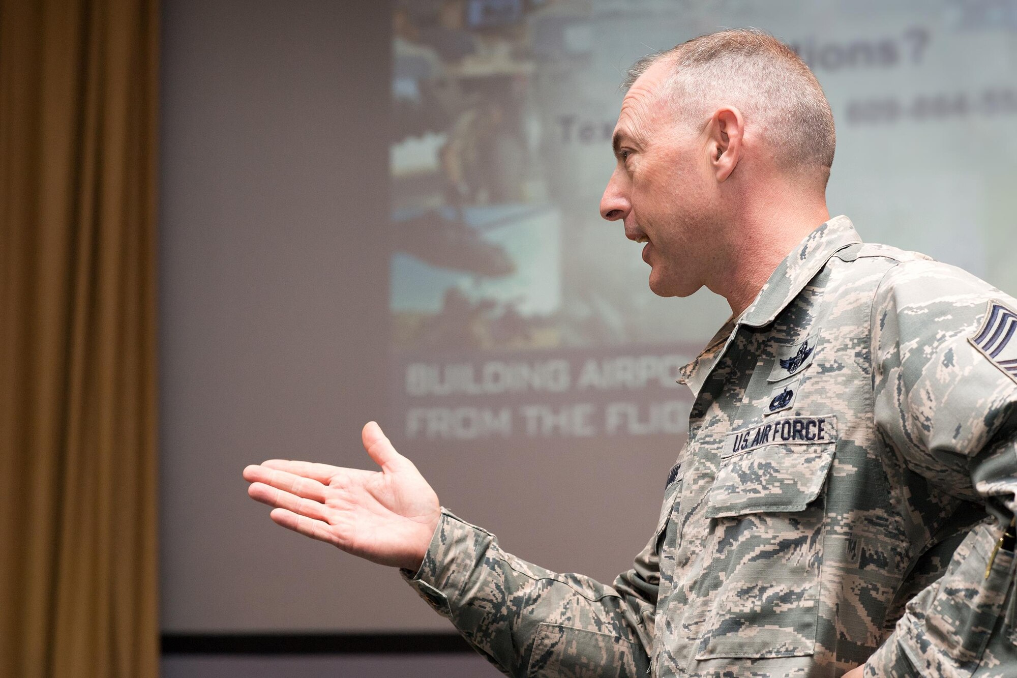 Chief Master Sgt. Larry Williams, U.S. Air Force Expeditionary Center command chief, responds to a question during the 43d Air Mobility Operations Group All Call held here Nov. 15. Williams toured Air Force units at Pope Field along with Maj. Gen. Christopher Bence, AFEC commander, Nov. 15-17. Williams became the AFEC command chief in December 2015. Both leaders, accompanied by their spouses, met and talked with 43d AMOG Airmen, and also participated in the Air Mobility Command civic leader tour during their visit to Fort Bragg. (Air Force photo/Marc Barnes)