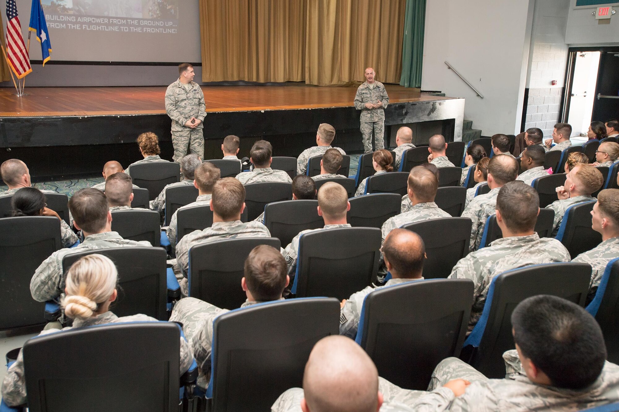 Chief Master Sgt. Larry Williams (right), U.S. Air Force Expeditionary Center command chief, speaks to 43d Air Mobility Operations Group Airmen as Maj. Gen. Christopher Bence (left), AFEC commander, looks on during an All Call held here Nov. 15. Both leaders, accompanied by their spouses, met and talked with 43d AMOG Airmen, and also participated in the Air Mobility Command civic leader tour during their visit to Fort Bragg Nov. 15-17. (Air Force photo/Marc Barnes)