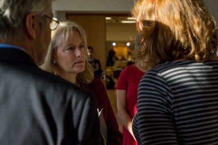 Mrs. Hollyanne Milley greets participants before the beginning of the Army Family Programs Roundtable discussion held at the 416th Theater Engineer Command Headquarters, Darien, Ill. The Roundtable discussion was a chance for spousal leadership throughout the three components of the Army to get ideas on improving the programs to meet the needs of Family readiness. Mrs. Hollyanne Milley, spouse of Chief of Staff of the United States Army, Gen. Mark Milley, represented the active Army; Mrs. Julie Luckey, spouse of Chief of Army Reserve, Lt. Gen. Charles Lucky, represented the Army Reserve; and Mrs. Danette Hayes, spouse of Adjutant General, Illinois National Guard, Maj. Gen. Richard J. Hayes Jr., represented the National Guard, November 15, 2016. (U.S. Army photo by Staff Sgt. Jason Proseus/released)