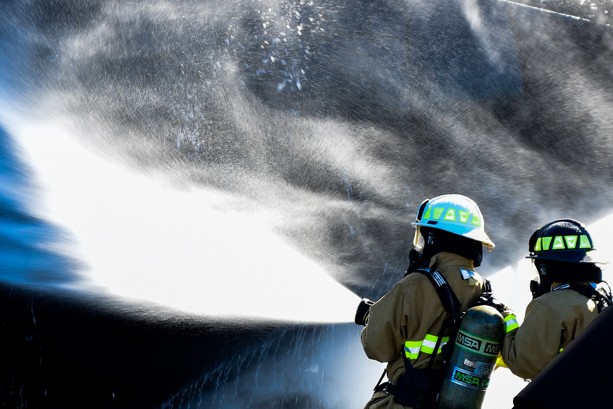 U.S Air Force Col. William Rock, 307th Mission Support Group commander, gets to see what it's like to fight fire during a live fire exercise on November 19, 2016, at Barksdale Air Force Base. Rock suited up for the training experience with the 307th Civil Engineering Squadron. (U.S. Air Force photo by Master Sgt. Laura Siebert/ Released)