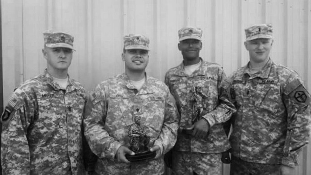 1st Sgt. Mitter, left, poses for a photograph with soldiers from the 387th Engineer Company, 315th Engineer Battalion, 301st Maneuver Enhancement Brigade at the 387th Engineer Company Best Warrior competition, September 22.