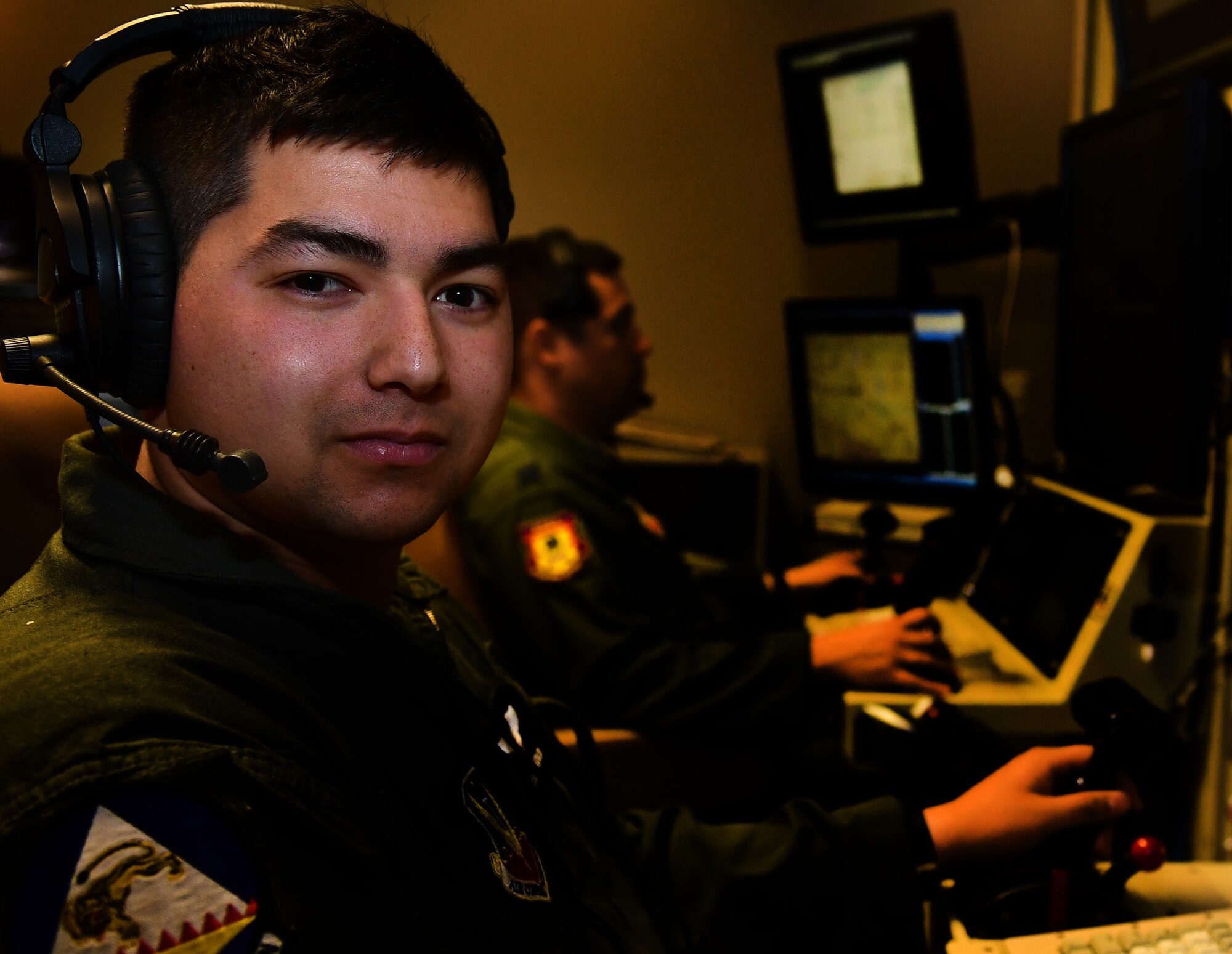 Senior Airman Than, 42nd Attack Squadron MQ-9 sensor operator, poses for a photo Nov. 28, 2016 at Creech Air Force Base, Nev. As a sensor operator Than is responsible for operating the Multi-Spectral Targeting System for reconnaissance and lasing targets for guided munitions. The position of sensor operator is open to enlisted Airmen and is unique because members as young as 20 play key roles in keeping U.S. and coalition ground forces safe while providing persistent attack and reconnaissance to the combatant commanders to contest terrorism. (U.S. Air Force photo by Senior Airman Christian Clausen)