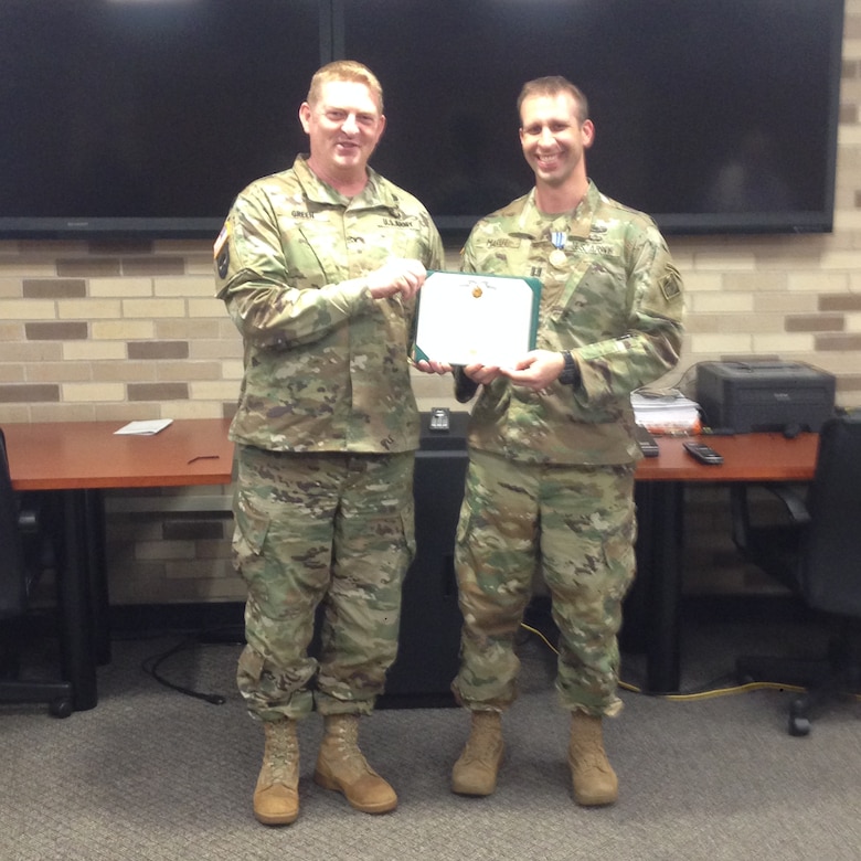 In photo (l to r), ERDC Commander Col. Bryan S. Green presents Capt. Joseph Marut III The Army Achievement Medal for outstanding support of a high-level visitor to the ERDC’s Cold Regions Research and Engineering Laboratory.