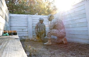 U.S. Army Sgt. Amber Holman, 7th Transportation Brigade (Expeditionary) cargo specialist, prepares to throw a live M228 grenade during qualification training at Fort Pickett, Va., Nov. 17, 2016. The training helped familiarize the Soldiers with the M228 grenade. (U.S. Army photo by Spc. Wilmarys Roman Rivera)