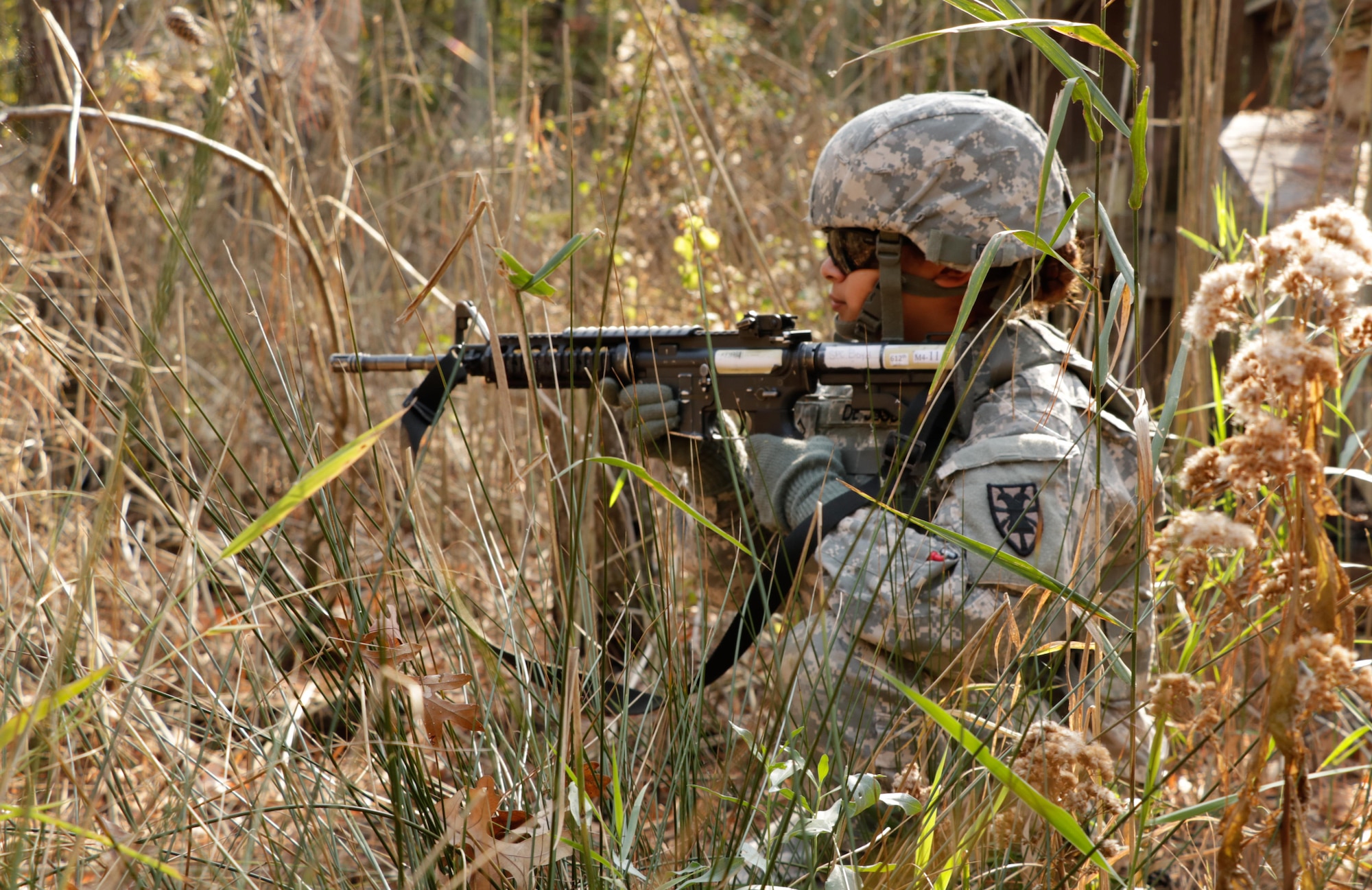 U.S. Army Pfc. Daisy DeJesus, 7th Transportation Brigade (Expeditionary) transportation management coordinator, secures the area during a grenade exercise at Fort Eustis Va., Nov. 1, 2016.  U.S. Army Soldiers practiced how to move under direct fire during the training. (U.S. Army photo by Spc. Wilmarys Roman Rivera)