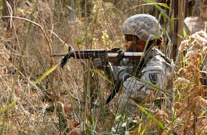 U.S. Army Pfc. Daisy DeJesus, 7th Transportation Brigade (Expeditionary) transportation management coordinator, secures the area during a grenade exercise at Fort Eustis Va., Nov. 1, 2016.  U.S. Army Soldiers practiced how to move under direct fire during the training. (U.S. Army photo by Spc. Wilmarys Roman Rivera)
