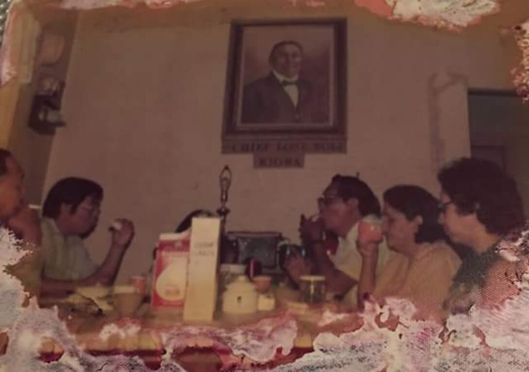 This old family photo shows Denise Wickson’s family gathered at a table below an image of their ancestor, Kiowa Chief Lone Wolf the Younger. Wickson is a U.S. Army Corps of Engineers, Southwestern Division civil servant who is sharing her family story in observance of Native American Indian Heritage Month.