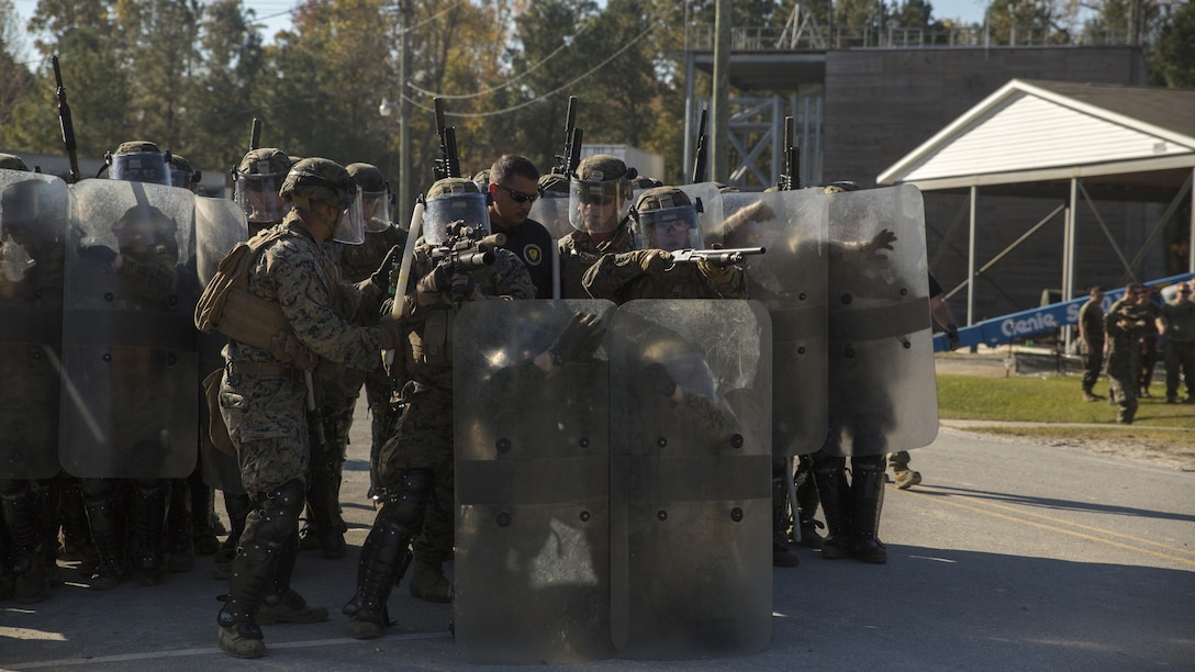 The shield line envelopes forward positioned Marines to recreate a solid front during the final exercise of the non-lethal weapons training course at Camp Lejeune N.C., Nov. 18, 2016. Marines with 3rd Battalion, 6th Marine Regiment, 2nd Marine Division, participated in the training in preparation for their deployment with the 24th Marine Expeditionary Unit. 