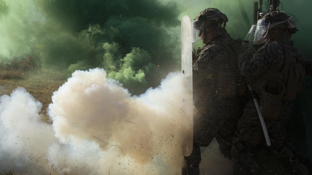 Marines push through a simulated riot during the final exercise of the non-lethal weapons training course at Camp Lejeune N.C., Nov. 18, 2016. Marines with 3rd Battalion, 6th Marine Regiment, 2nd Marine Division, participated in the training in preparation for their deployment with the 24th Marine Expeditionary Unit. 
