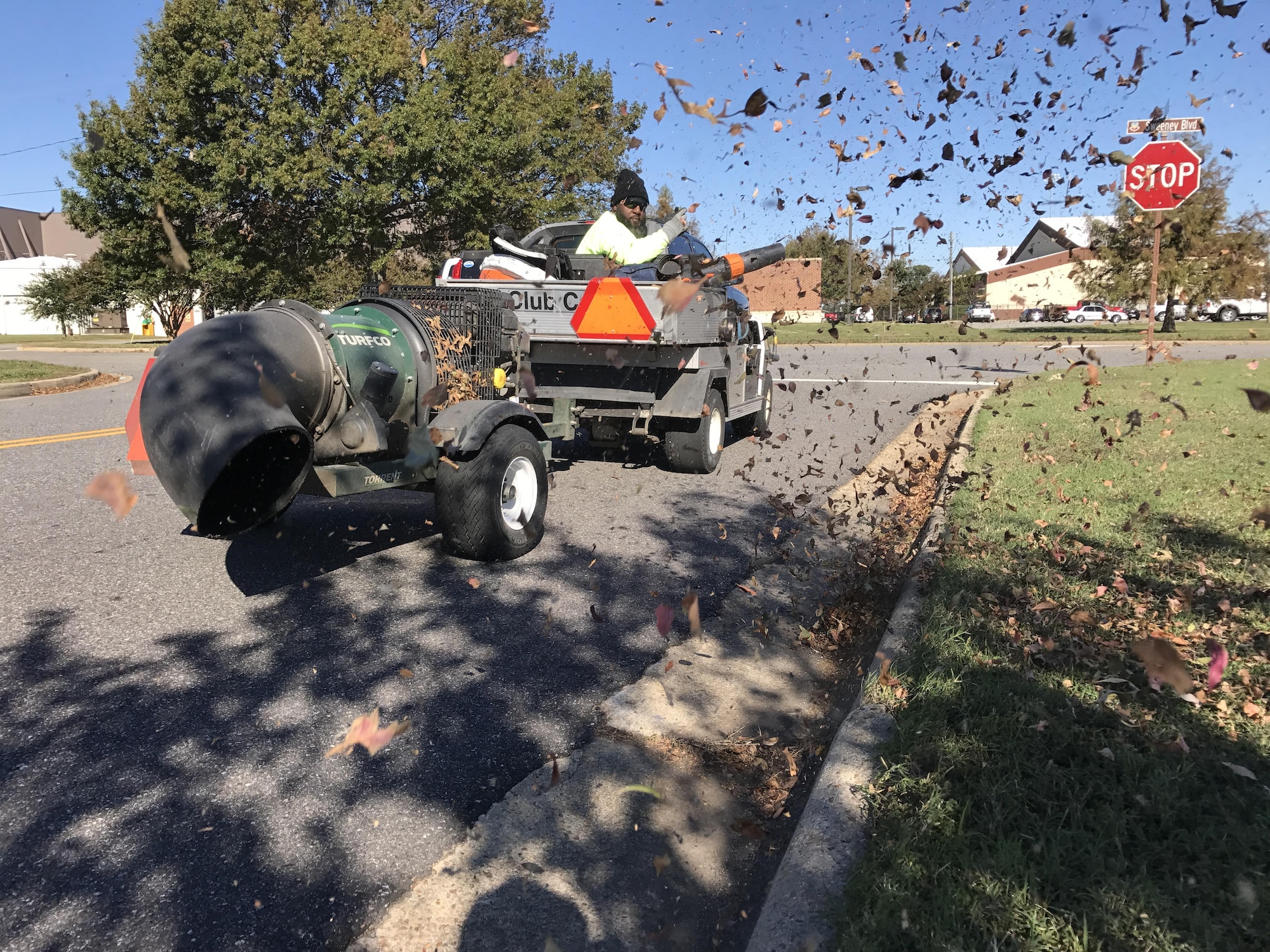 Roderick Wyche Sr., grounds maintainer, clears off curbs using a new wireless control blower at Joint Base Langley-Eustis, Va., Oct. 30, 2016. The wireless control blower is capable of blowing debris 10 times faster than a backpack blower. (U.S. Air Force photo by Tetaun Moffett)