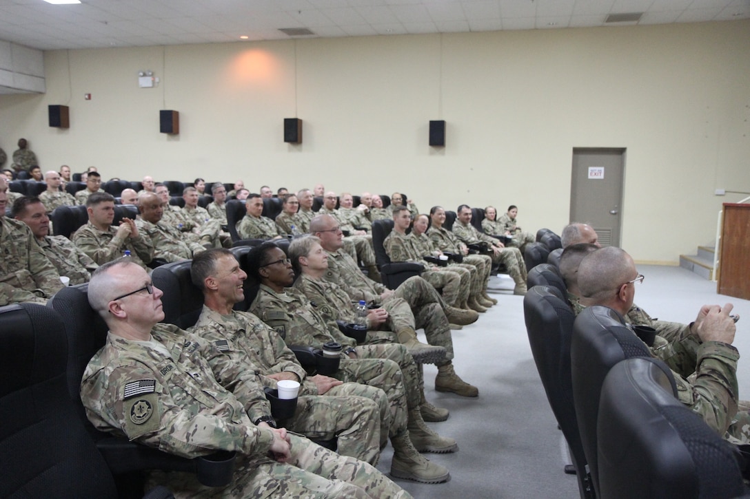 Soldiers of the 451st Expeditionary Sustainment Command attend a town hall meeting held by Army Reserve Maj. Gen. Mark W. Palzer, commanding general of the 79th Sustainment Support Command, and Brig. General Bruce E. Hackett, commanding general of the 451st ESC, Nov. 28, 2016 at Camp Arifjan, Kuwait.