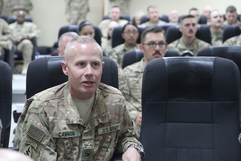 Army Reserve Col. Sean Cannon, deputy commanding officer with the 451st Expeditionary Sustainment Command, asks questions during a town hall meeting held by Maj. Gen. Mark W. Palzer, commanding general of the 79th Sustainment Support Command and Brig. General Bruce E. Hackett, commanding general of the 451st ESC, Nov. 28, 2016 at Camp Arifjan, Kuwait.