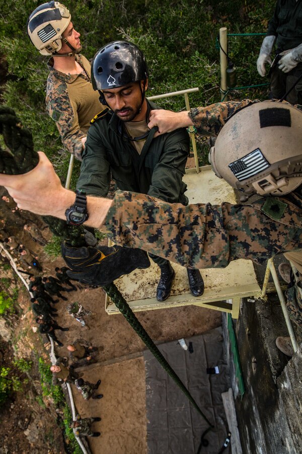 TRINCOMALEE, Sri Lanka (Nov. 23, 2016) A Sri Lankan Navy Special Boat Squadron Sailor prepares to slide down a fast rope during a Theater Security Cooperation engagement at Sri Lanka Naval Base, Trincomalee, Nov. 23, 2016. The Maritime Raid Force trained 40 Sri Lankan SBS Sailors on how to fast rope out of a helicopter or from a static tower. Both the United States and Sri Lanka have a continuing interest in strengthening their partnership based on common interests related to maritime security, humanitarian assistance and disaster relief preparedness, and the security and stability in the region. (U.S. Marine Corps photo by Gunnery Sgt. Robert B. Brown/Released)
