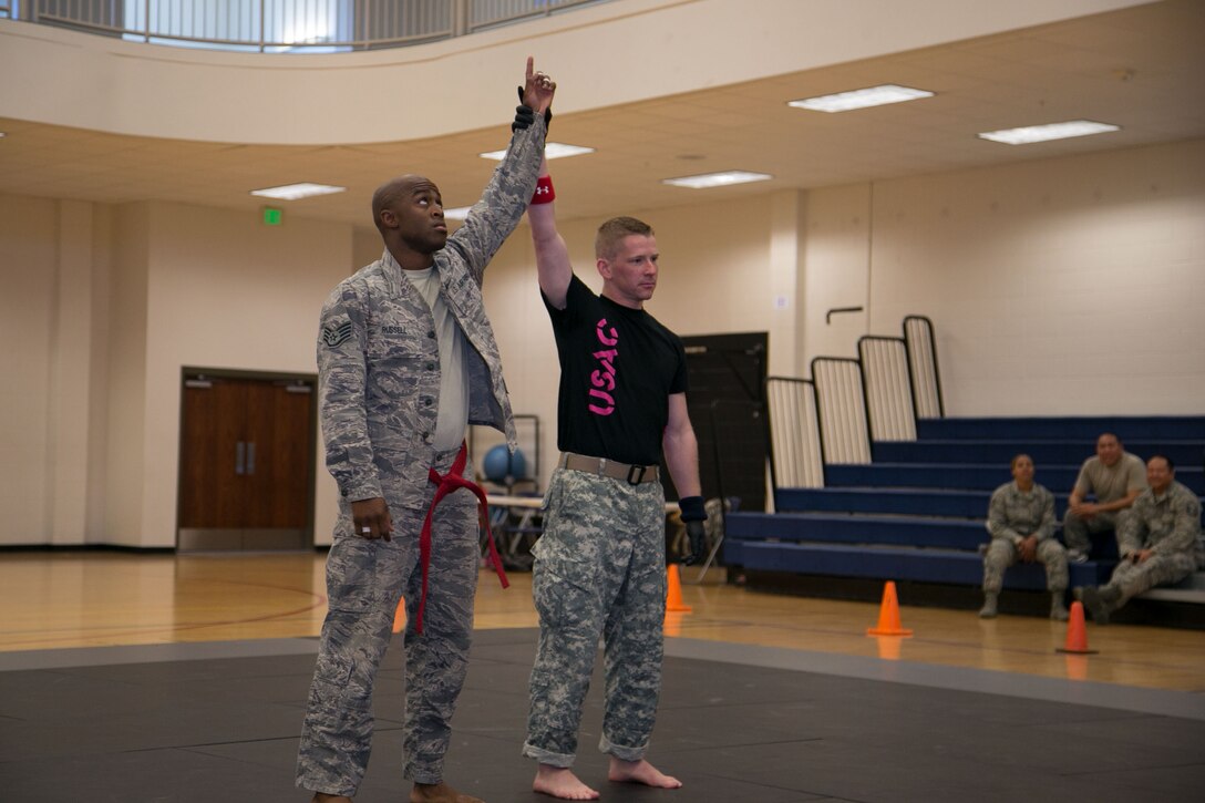 Staff Sgt. Brandon Russell, Air Reserve Personnel Center, is named winner of a match during an Army Combatives Tournament at Buckley Air Force Base, Colo., Oct. 26. Russell defeated more than 15 Soldiers to place first in his division and was awarded an Army Achievement Medal. (Courtesy photo by Annabel Flores)