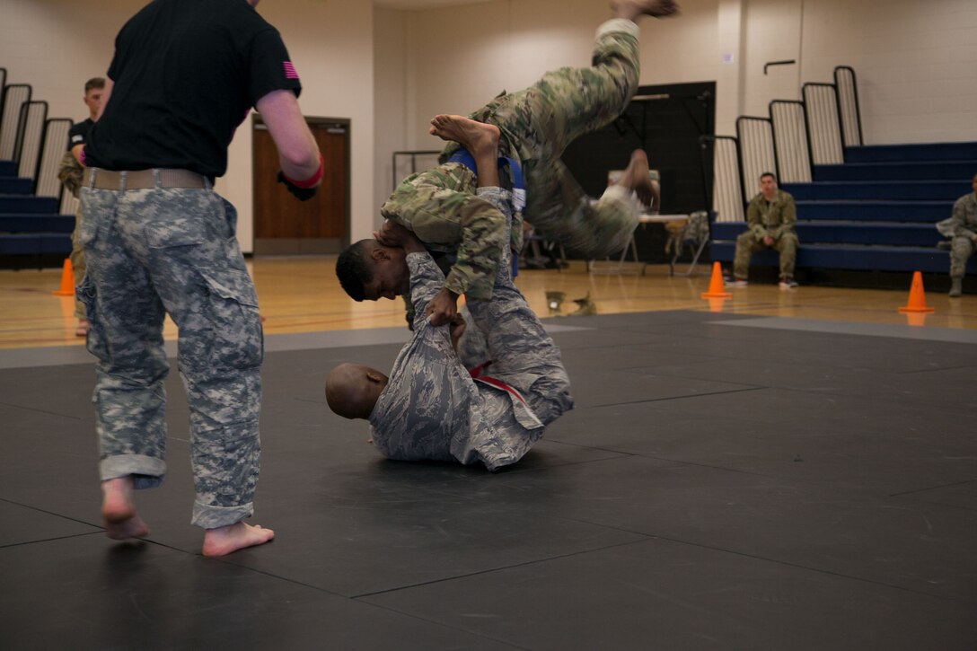 Staff Sgt. Brandon Russell, Air Reserve Personnel Center, uses his Brazilian Jiu Jitsu training to battle his opponent during an Army Combatives Tournament at Buckley Air Force Base, Colo., Oct. 26. Russell defeated more than 15 Soldiers to place first in his division and was awarded an Army Achievement Medal. (Courtesy photo by Annabel Flores)