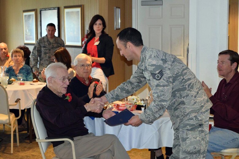 Several members of the 914th Airlift Wing, Air Force Reserve and 107th Attack Wing, Air National Guard, participated in a Veterans Day program at The Elderwood Residences at Wheatfield (NY) November 11, 2016. The Niagara Airmen assisted the staff of Elderwood in presenting certificates of recognition to the veterans living within the community and thanking them for their service. (U.S. Air Force photo by Master Sgt. Kevin Nichols)