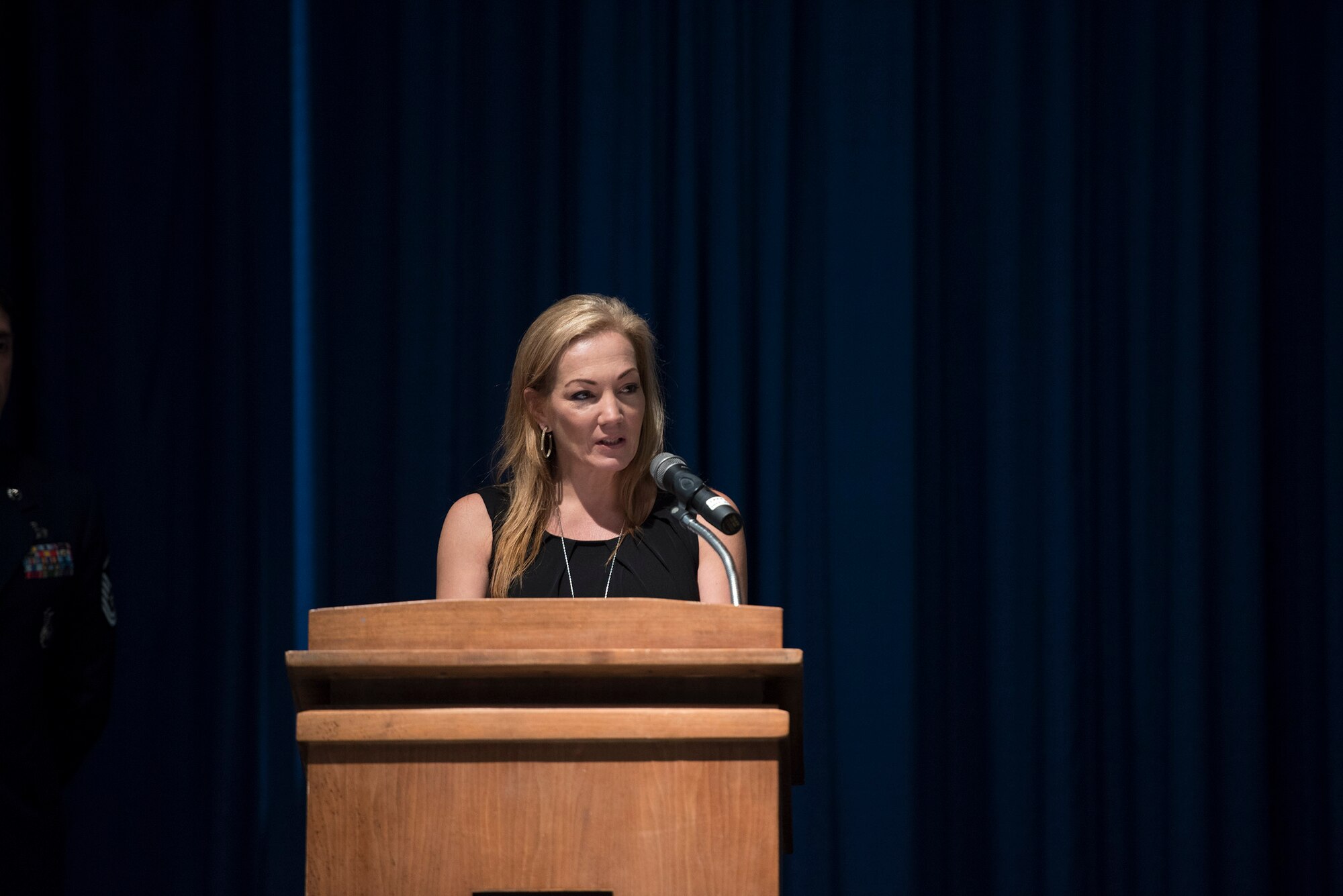 Autumn Barton, mother of Senior Airman Sebastian Jenkins, 822d Base Defense Squadron fire team member, shares memories in her son’s honor during a memorial service, Nov. 29, 2016, at Moody Air Force Base, Ga. 
Barton spoke about Jenkins’ unwavering loyalty to the 822d BDS and will mostly remember his loving and humorous demeanor. (U.S. Air Force photo by Airman 1st Class Greg Nash)
