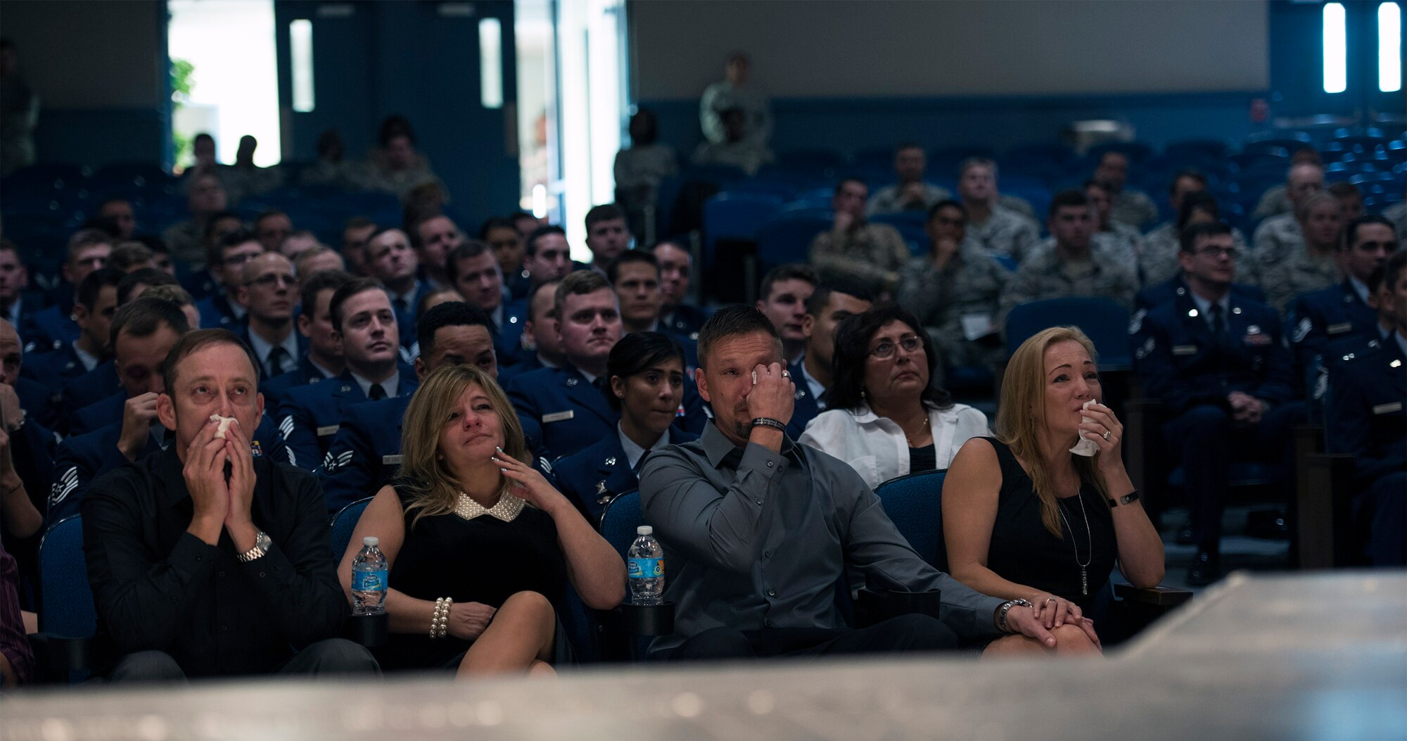 Family, friends and members of the 23d Wing and 93d Air Ground Operations Wing, mourn during Senior Airman Sebastian Jenkins’ memorial service, Nov. 29, 2016, at Moody Air Force Base, Ga. Jenkins, a Charleston, S.C. native, is survived by his brother, Tristan, his mother, Autumn Barton, and father, Kirk Jenkins. (U.S. Air Force photo by Airman 1st Class Greg Nash)
