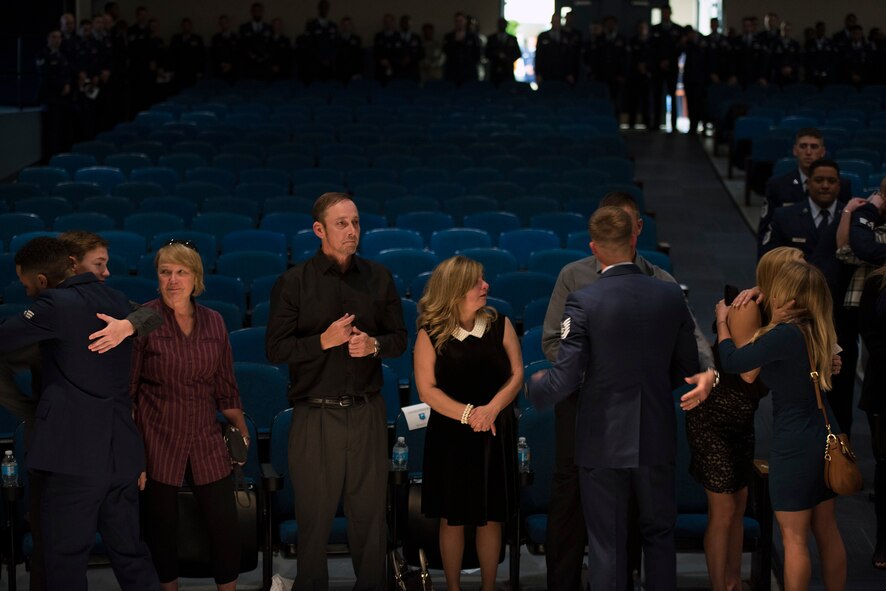 Members of Moody’s 93d Air Ground Operations Wing console Senior Airman Sebastian Jenkins’ family during a memorial service, Nov. 29, 2016, at Moody Air Force Base, Ga. Jenkins, a 822d Base Defense Squadron fire team member, was 23-years-old and was pursuing higher education in criminal justice. (U.S. Air Force photo by Airman 1st Class Greg Nash)