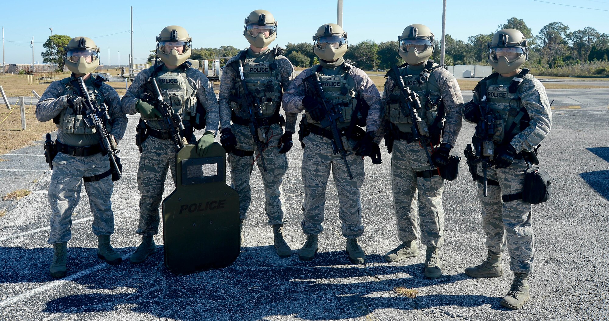 Emergency services team (EST) members assigned to the 6th Security Forces Squadron (SFS) pause for a group photo during an immersion, Nov. 21, 2016 at MacDill Air Force Base, Fla. During the immersion, the 6th Security Forces Squadron demonstrated the capabilities of their SWAT and emergency services teams. (U.S. Air Force photo by Senior Airman Jenay Randolph)