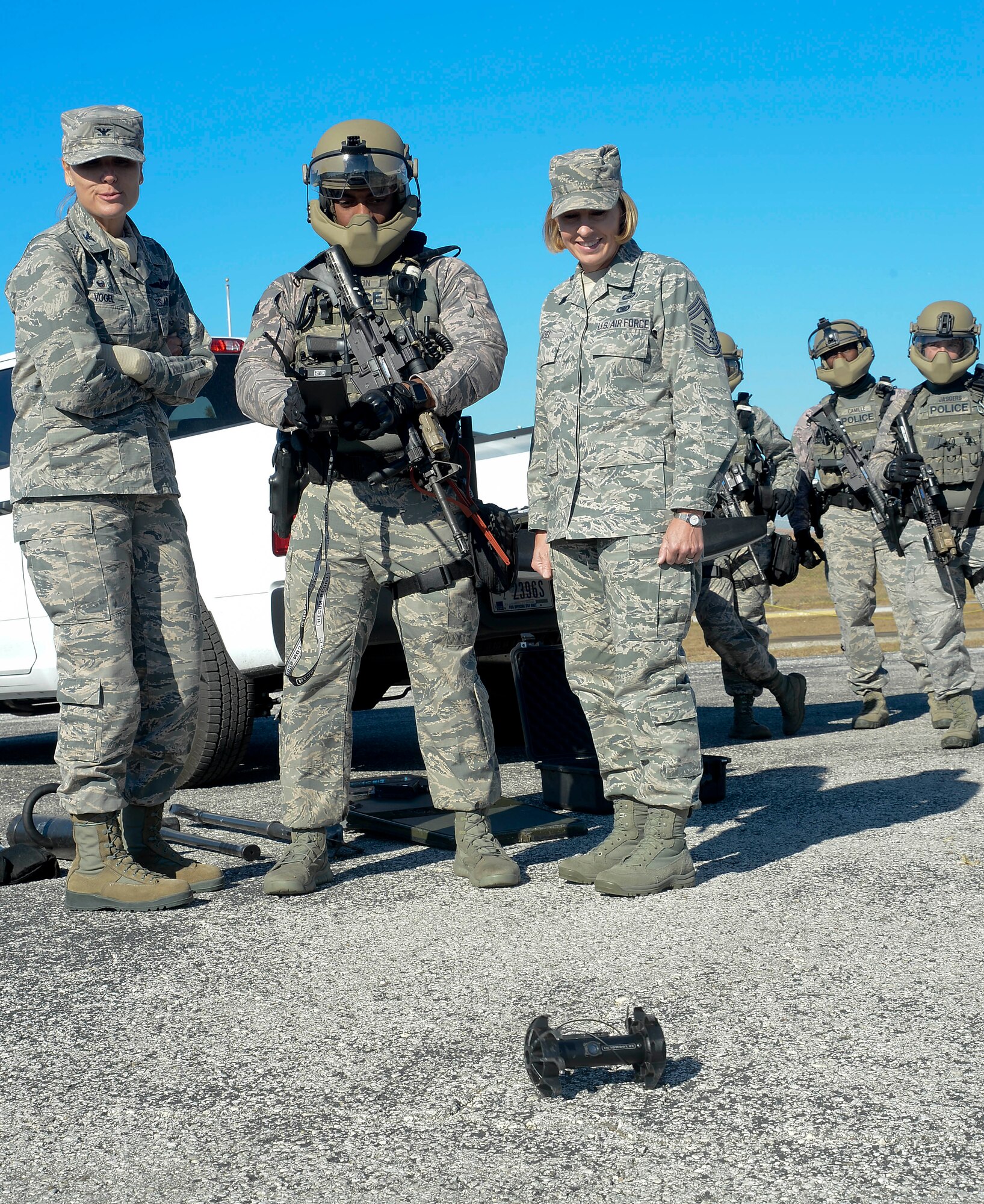 Col. April Vogel, commander of the 6th Air Mobility Wing (AMW), and Chief Master Sgt. Melanie Noel, command chief of the 6th AMW, right, watch a brief demonstration of the equipment used by the special weapons and tactical (SWAT) teams during an immersion, Nov. 21, 2016 at MacDill Air Force Base, Fla. During the visit, Vogel and Noel were briefed on the mission of the SWAT team and their daily operations. (U.S. Air Force photo by Senior Airman Jenay Randolph) 