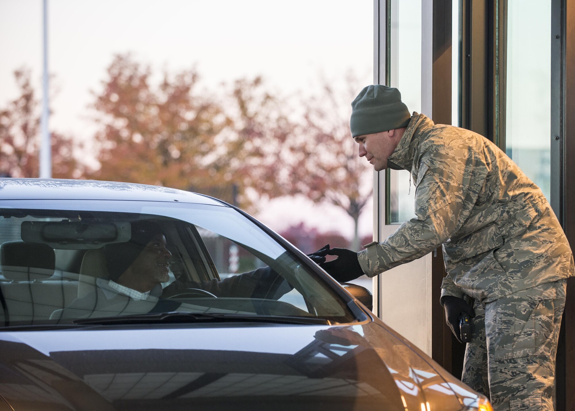 Lt. Col. Aaron Oelrich, 436th Operations Support Squadron commander, checks a driver’s identification card as he enters the base during the Thanksgiving Weekend safety send-off Nov. 23, 2016, at Dover Air Force Base, Del. During the sendoff, drivers and passengers were reminded to be safe over the long weekend. (U.S. Air Force photo by Staff Sgt. Jared Duhon)