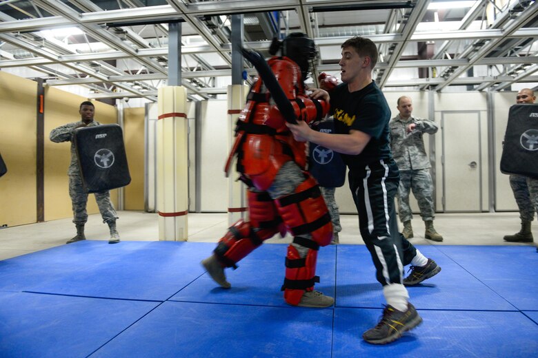 SCHRIEVER AIR FORCE BASE, Colo.-- 2nd Lt. Marco Lara, World Class Athlete Program wrestler, participates in RedMan baton training during his visit to the Security Forces training complex at Schriever Air Force Base, Colorado, Nov. 15, 2016. The purpose of RedMan training is to give law enforcement, military and corrections officers the tools they need to prepare for real-life encounters. (U.S. Air Force photo/Christopher DeWitt)