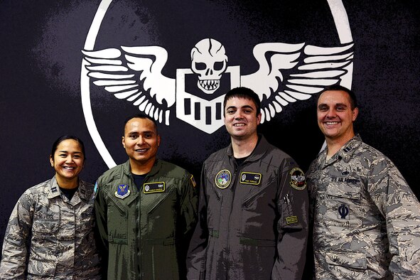 1st Lt. Anthony Perkins, center right, 490th Missile Squadron intercontinental ballistic missile combat crew commander, poses for a photo with his teammates Nov. 4, 2016, at Malmstrom Air Force Base, Mont. Perkins is a missileer, as well as a volunteer firefighter and ambulance emergency medical technician in his off-duty time. (U.S. Air Force photo/Airman 1st Class Magen M. Reeves)