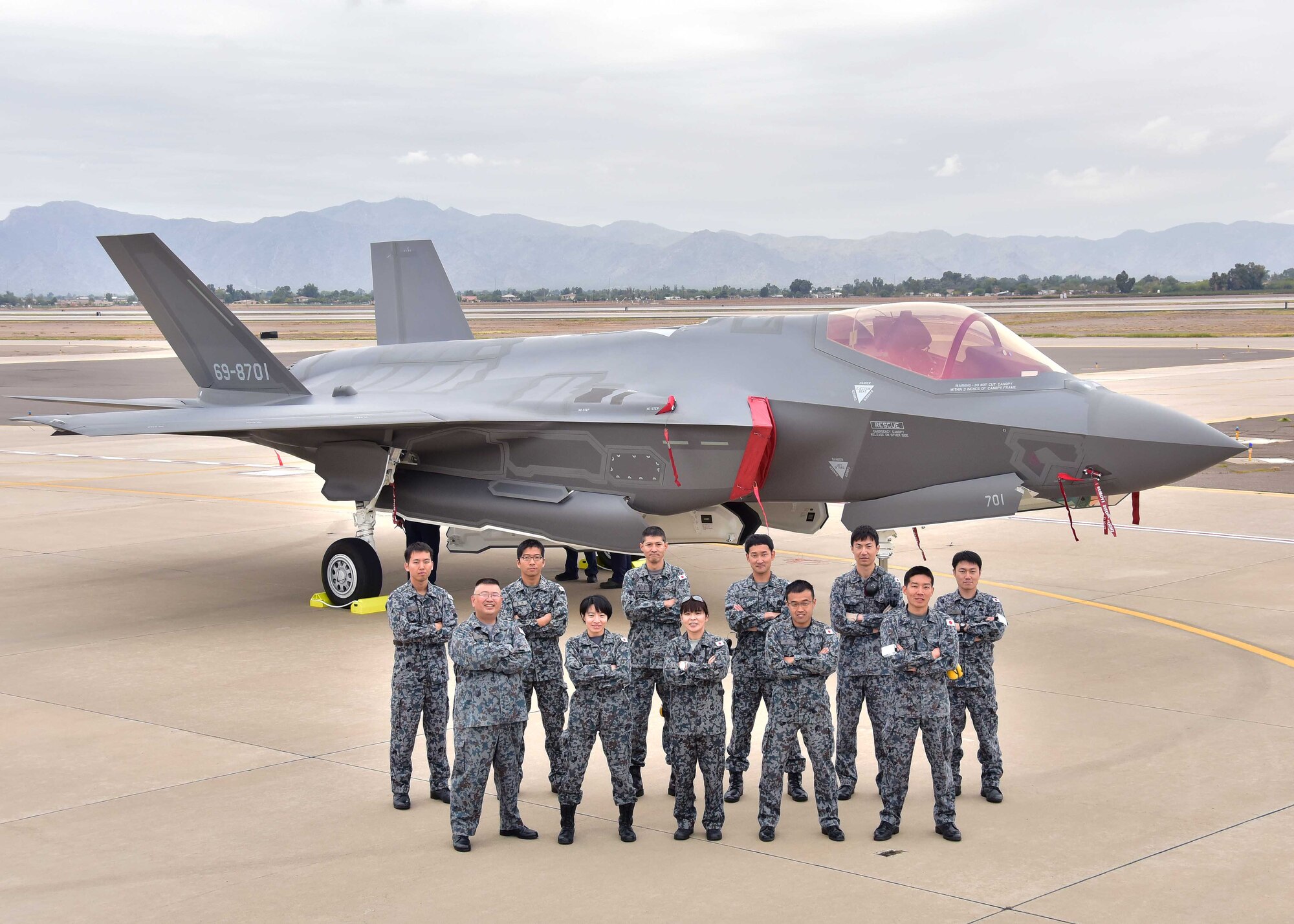 The Japanese Air Self-Defense Force maintainers pose for a photo Nov. 28 during the arrival of the first Japanese F-35A at Luke Air Force Base Ariz. (U.S. Air Force photo by Tech. Sgt. Louis Vega Jr.)