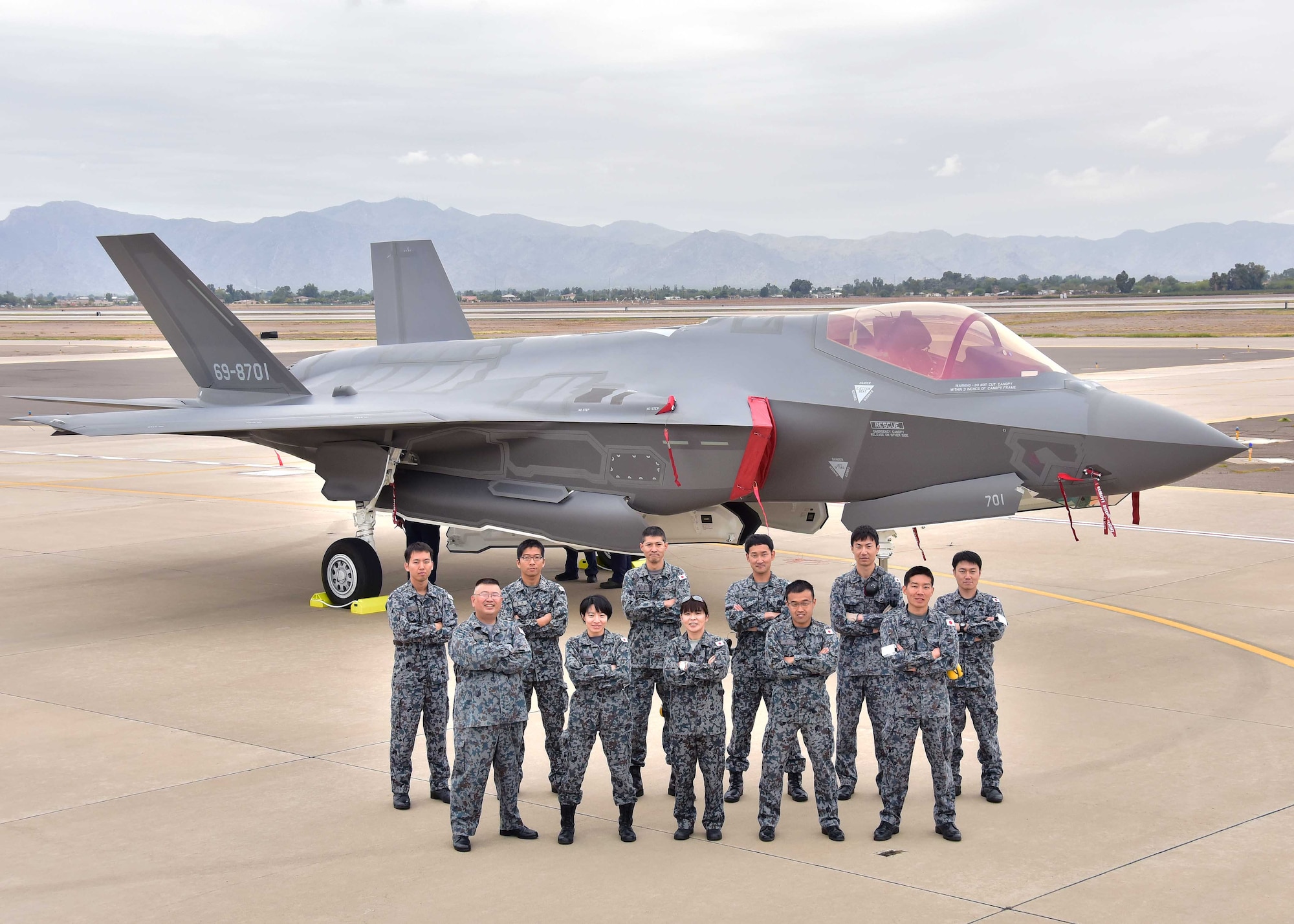 The Japanese Air Self-Defense Force maintainers pose for a photo Nov. 28 during the arrival of the first Japanese F-35A at Luke Air Force Base Ariz. (U.S. Air Force photo by Tech. Sgt. Louis Vega Jr.)