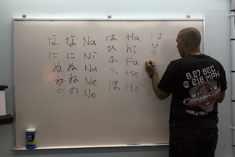 A student practices writing Japanese hiragana characters on a whiteboard during a Survival Japanese Language Class Nov. 29 on Marine Corps Air Station Futenma, Okinawa, Japan. The class taught students the basic principles of spoken and written Japanese. During the lesson, students practiced reading and writing the three forms of Japanese writing called hiragana, katakana and kanji. After the reading and writing practice, students practiced speaking basic everyday Japanese words and phrases. (U.S. Marine Corps photo by Cpl. Janessa K. Pon)