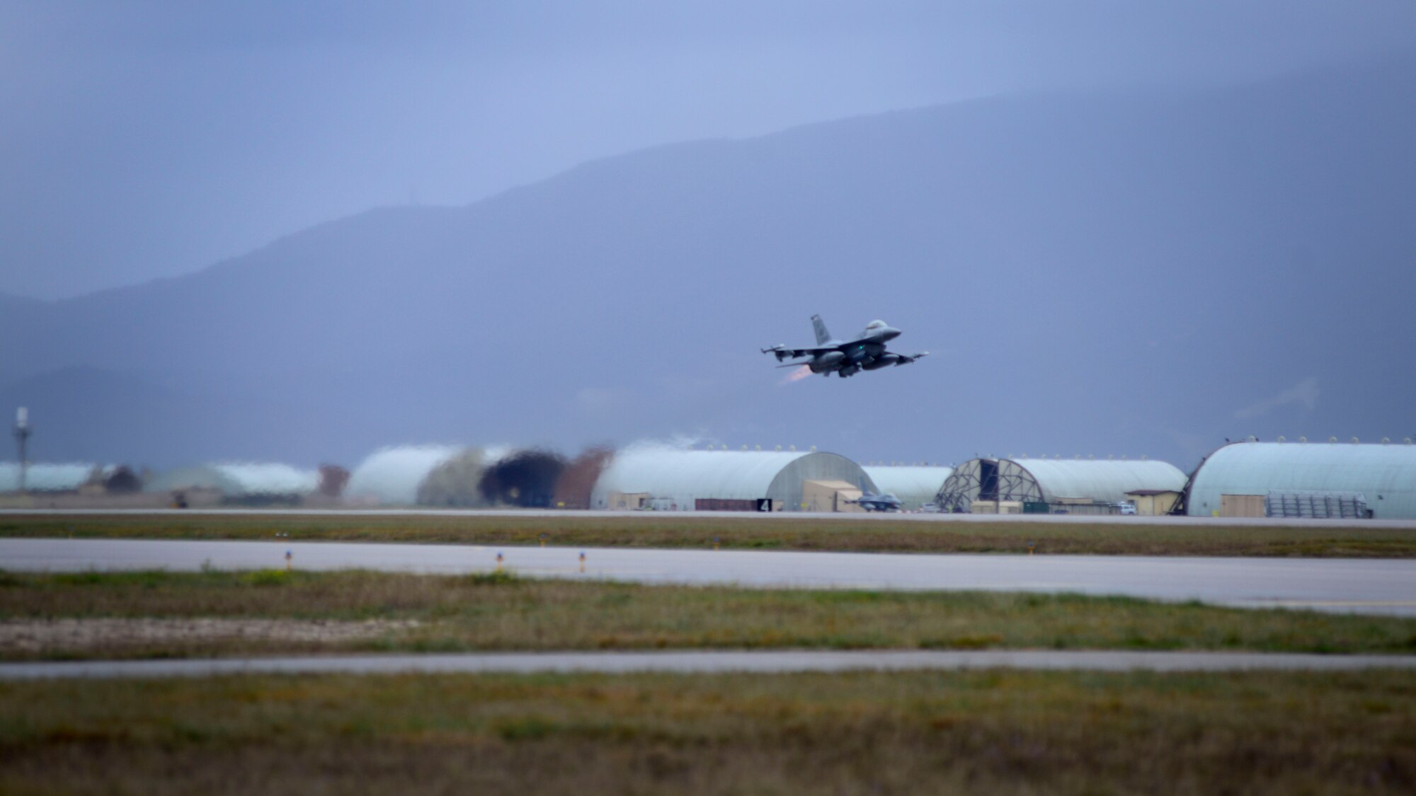 A 510th Fighter Squadron F-16 Fighting Falcon, departs for exercise Ramstein Dust II-16 on Nov. 21, 2016 at Aviano Air Base, Italy. The exercise was conducted at the Deployable Air Command and Control Centre headquartered at Poggio Renatico, Italy. The exercise demonstrated the DACCC’s ability to deploy with operational capability and provide tactical control of live air operations. (U.S. Air Force photo by Senior Airman Areca T. Bell)